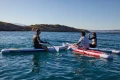 Gladiator Origin 10.6 – deski SUP Gladiator z serii Origin na wodzie, ujęcie lifestyle podczas wspólnego pływania